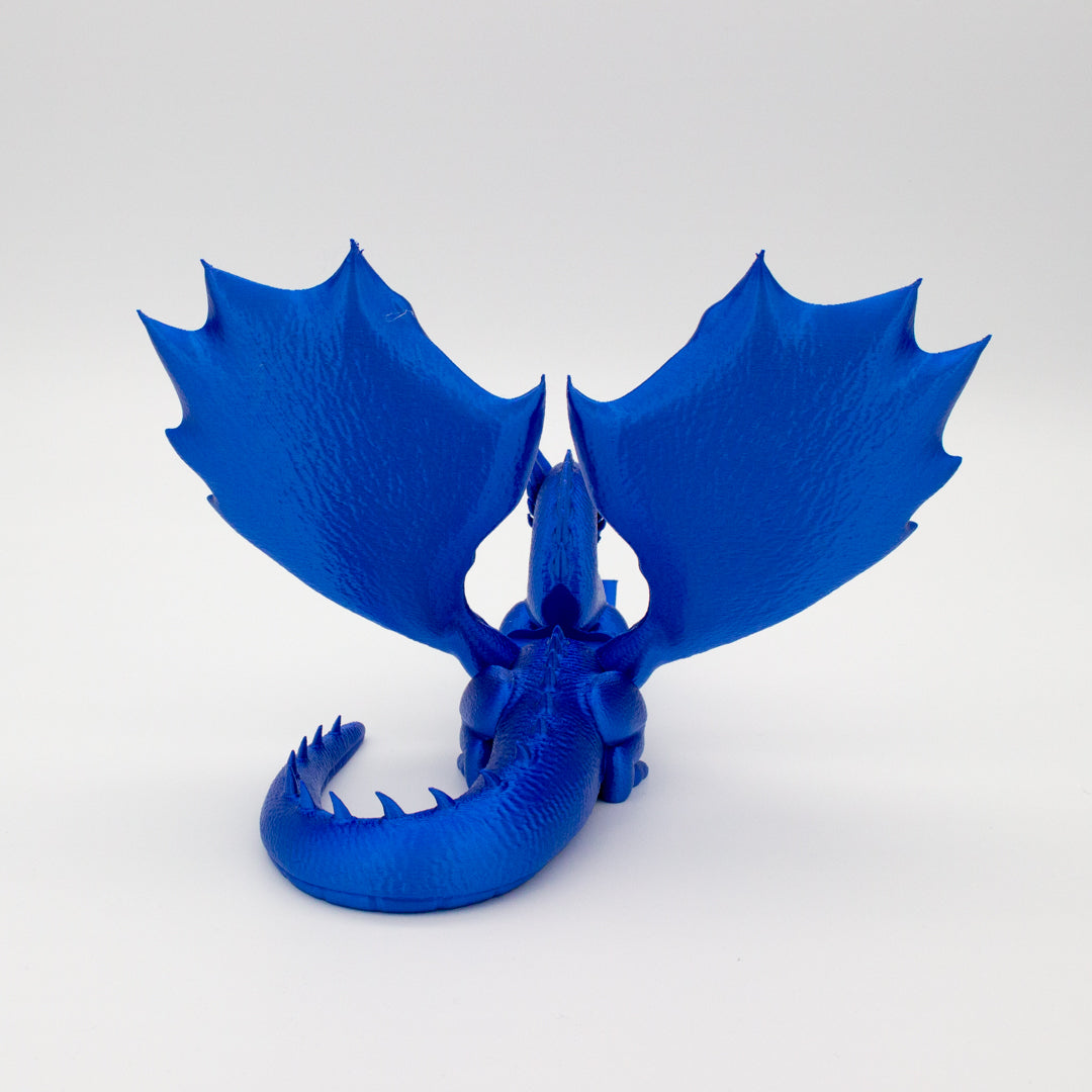 Dragón sujeta libros