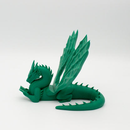 Dragón sujeta libros