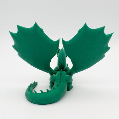 Dragón sujeta libros