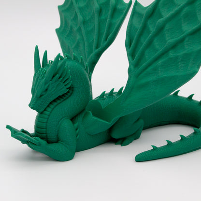 Dragón sujeta libros