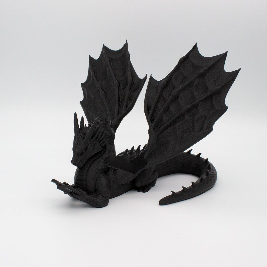 Dragón sujeta libros