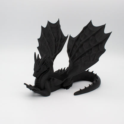 Dragón sujeta libros