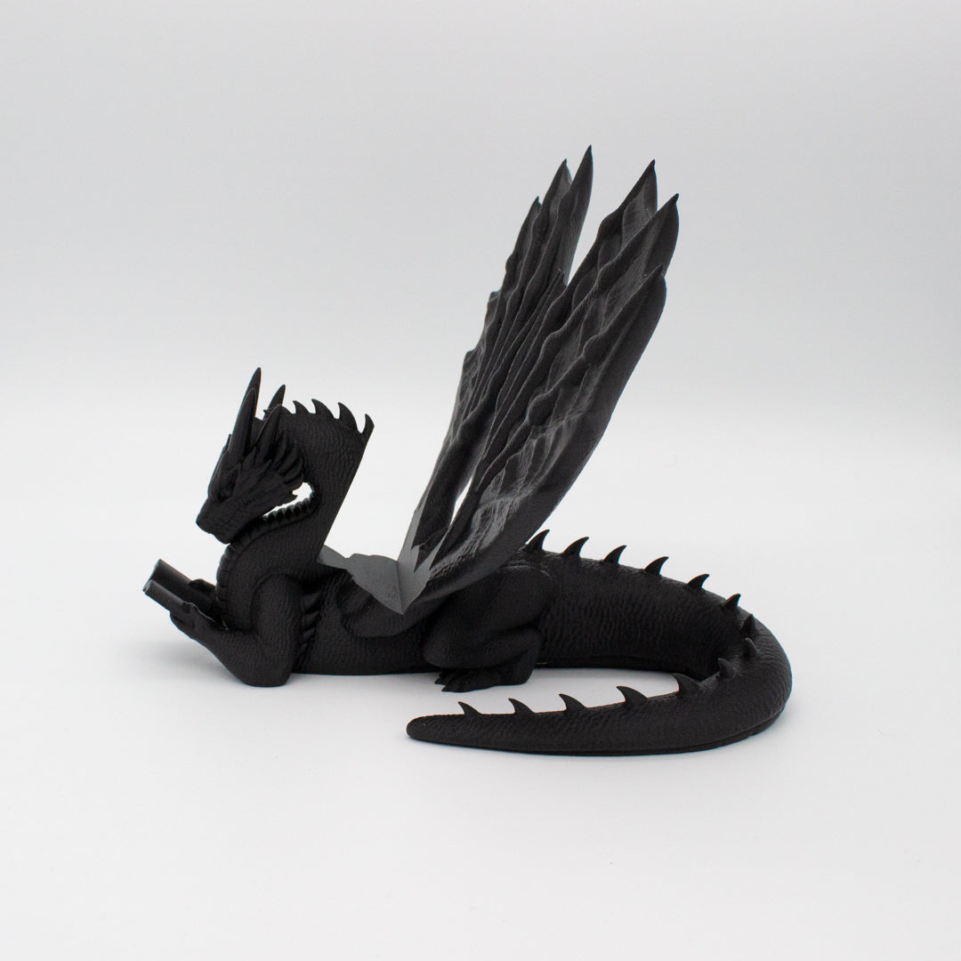 Dragón sujeta libros