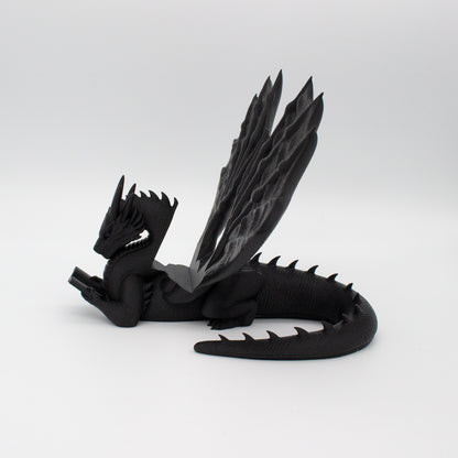 Dragón sujeta libros