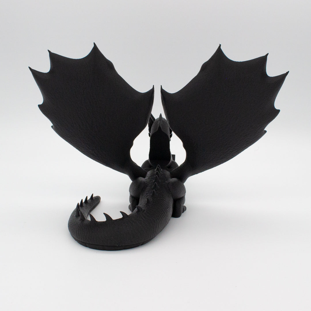 Dragón sujeta libros